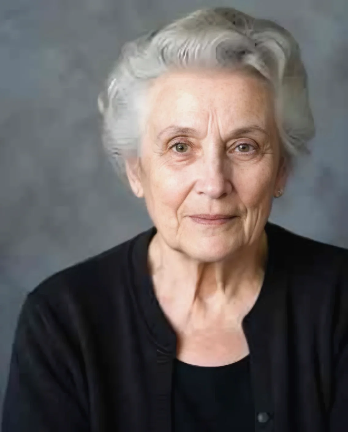 The same portrait after AI face restoration, with the face sharp again